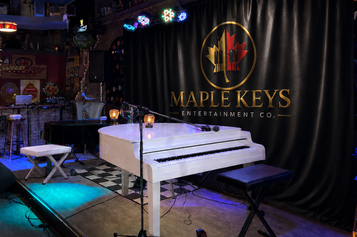 Maple Keys Entertainment Co. white grand piano on stage with branded backdrop